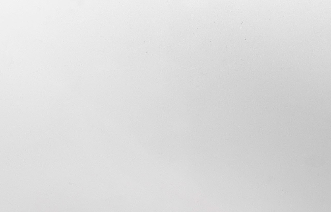 Close-up of Classic White Quartz slab showing a smooth, bright white surface with a uniform finish