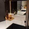 Volakas White Porcelain worktop by the sink area with a polished finish, shown with tap and countertop items.