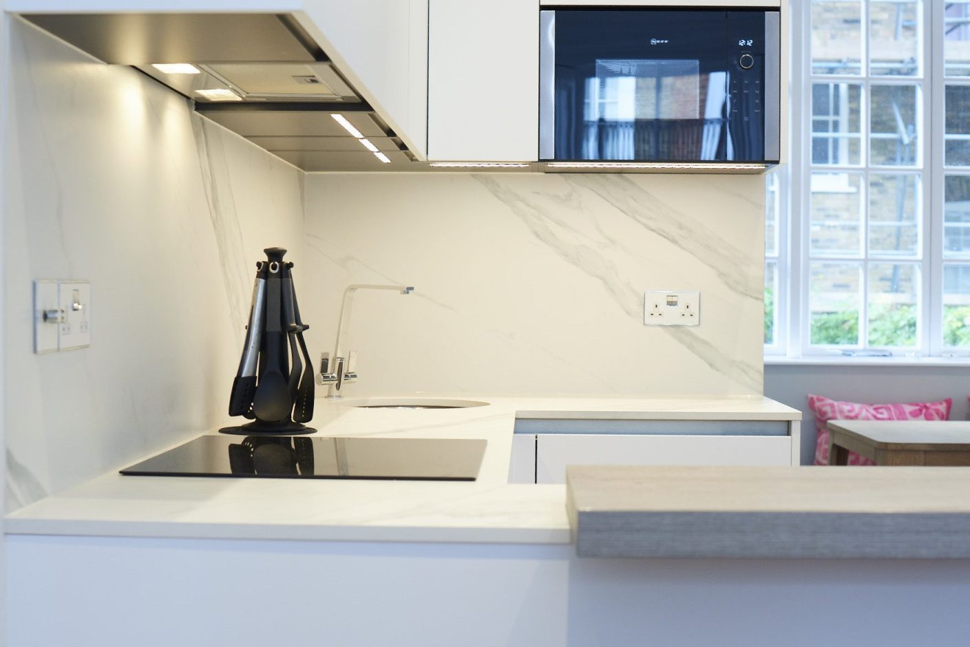 Opera Porcelain kitchen worktop with integrated sink and light cabinetry