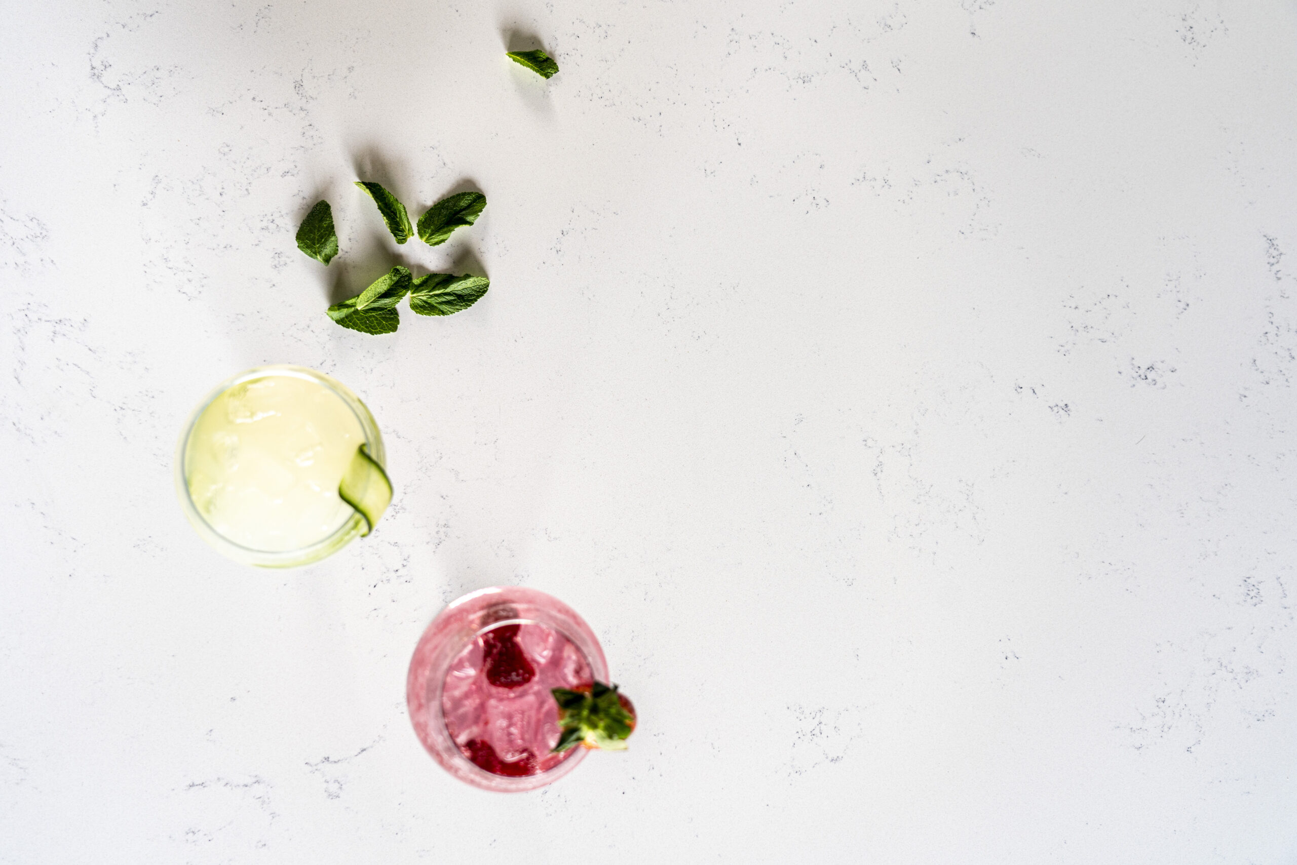 Close-up of Bluetta Carrara Quartz worktop surface with subtle grey veining and light speckling