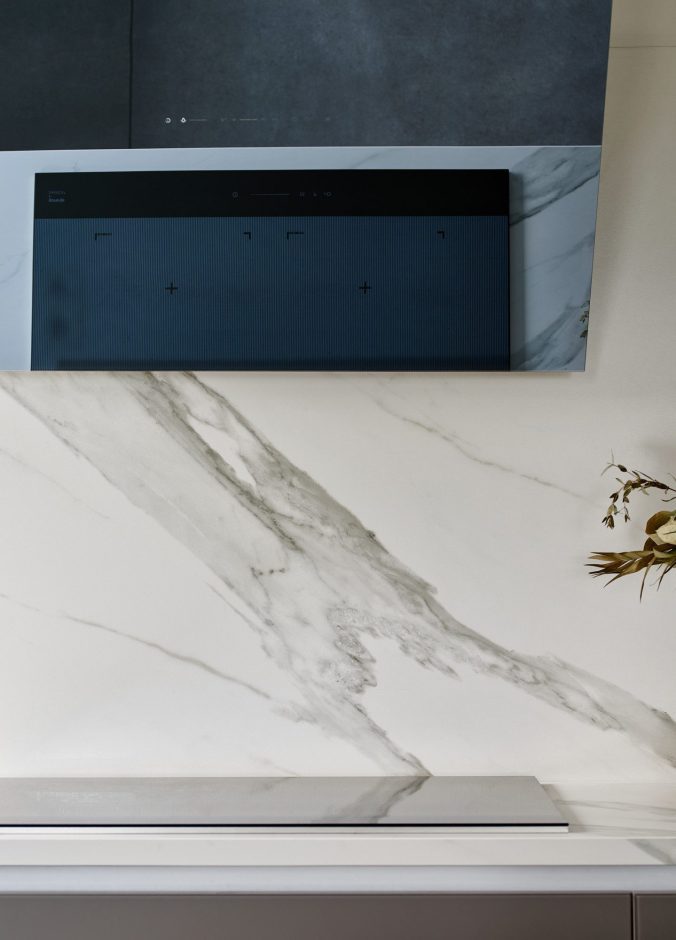 Opera Porcelain splashback with soft grey veining behind kitchen units