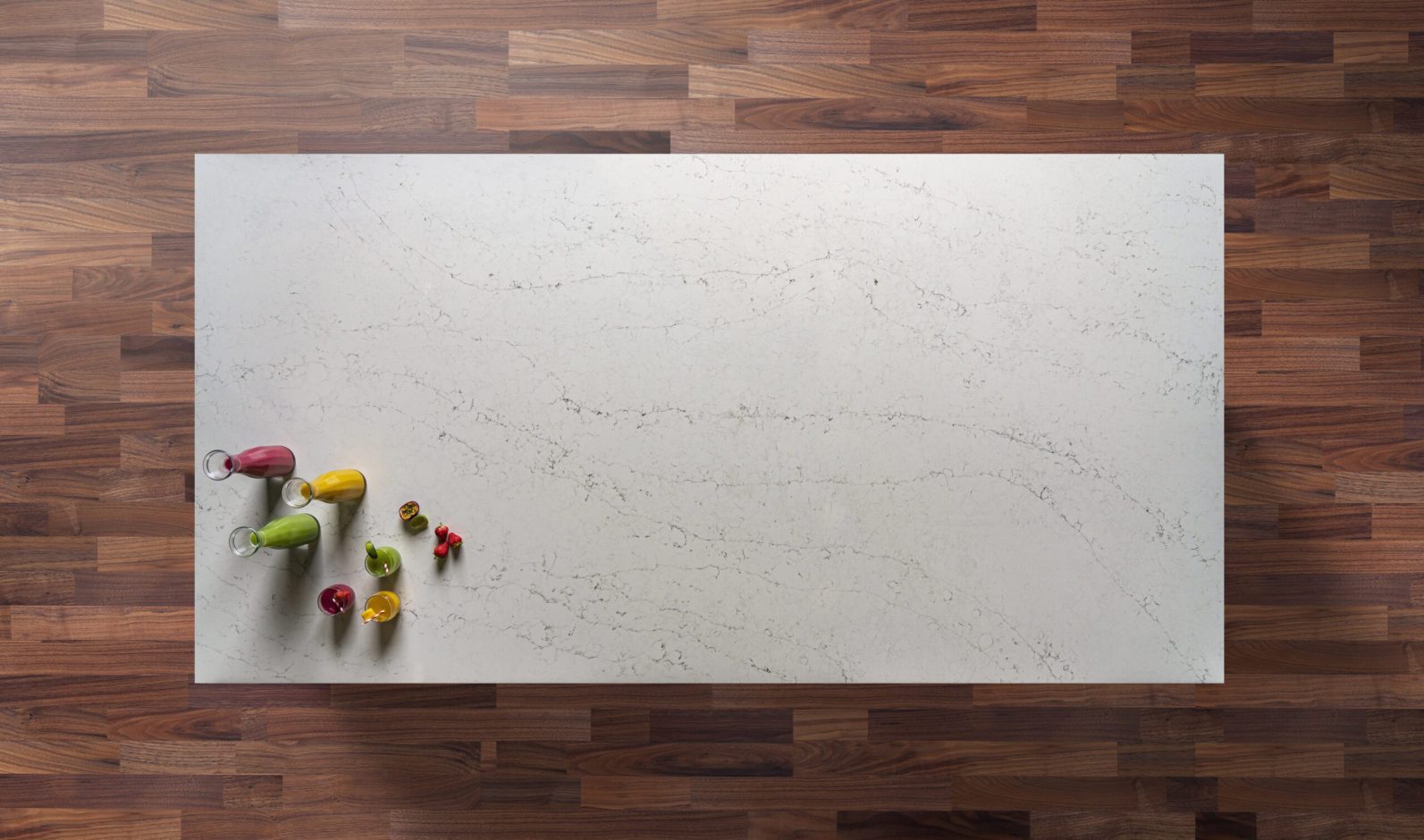 Eternal Carrara Quartz worktop shown from above with soft grey veining and fine speckling across an off-white surface