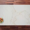 Overhead view of Gold Statuario Quartz worktop with sweeping gold veining across a bright white surface