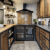 Wide kitchen view with Steel Grey leather Granite worktops on both sides, showing the textured Granite finish, rustic wood cabinetry and a black range cooker.