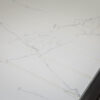 White Macaubus Quartz worktop close-up showing delicate grey veining and a clean white finish