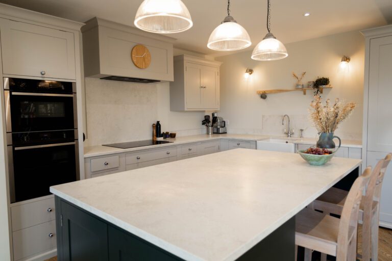 White Concrete Quartz island worktop in a light kitchen showing smooth surface finish and clean edge lines