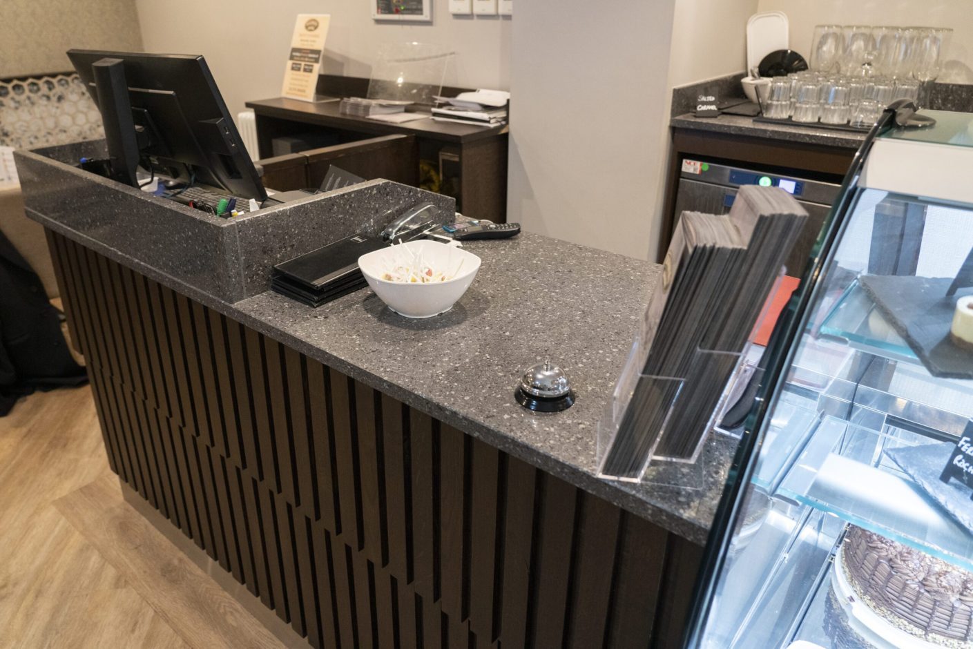 Titanium Quartz counter in a commercial setting with speckled grey surface and serving area layout