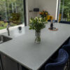 Modern kitchen with Carrara Quartz worktops and light grey veining