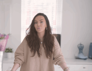 Tania giving a testimonial in her kitchen featuring Statuario Bianco Porcelain worktops installed by Mayfair Worktops