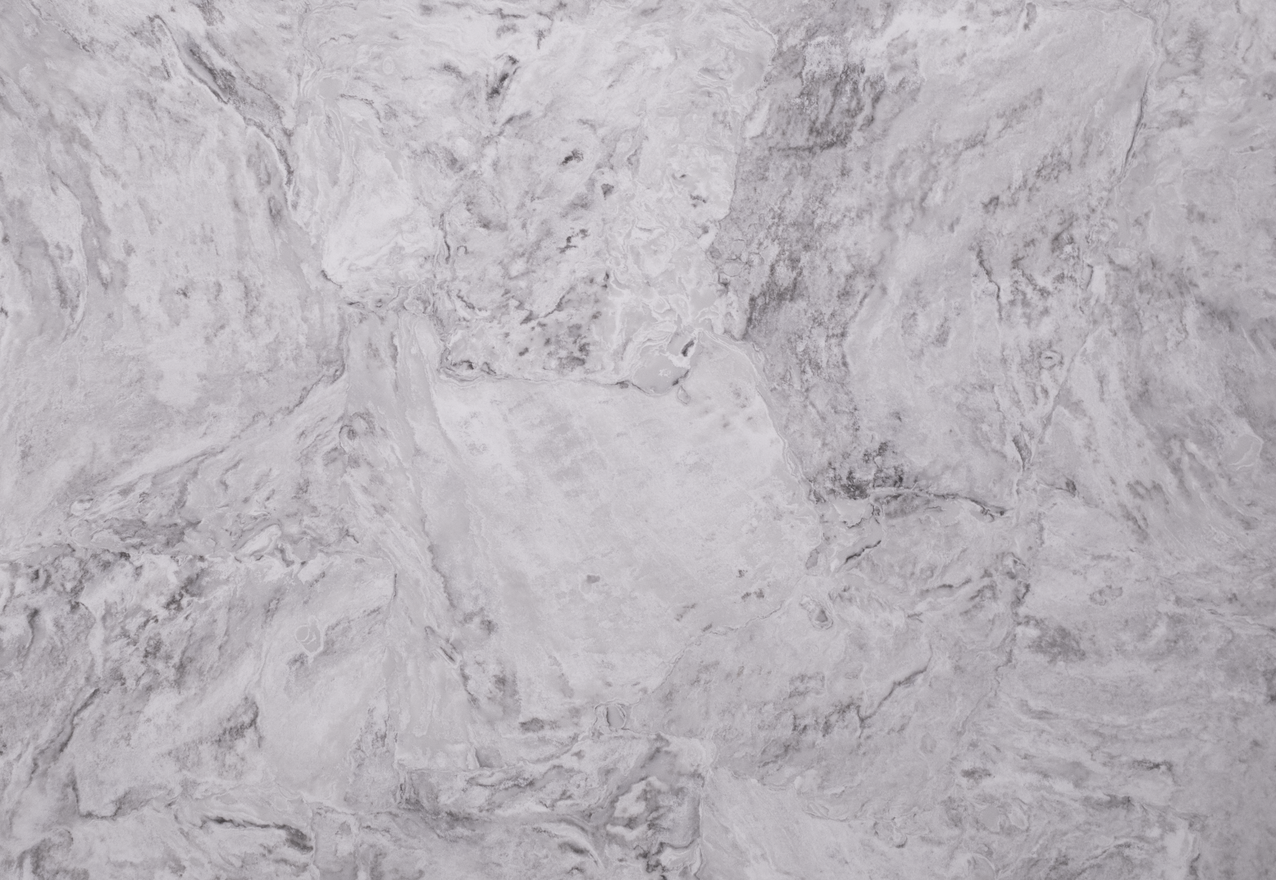 Ivory Drift Quartz slab close-up showing flowing grey veining and cloudy stone-style patterning