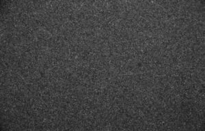 Close up slab photo of honed Absolute Black Granite showing a deep black tone with a smooth matte finish and subtle natural texture.