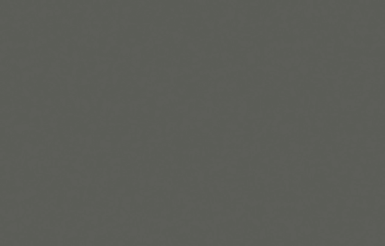 Cemento Spa Porcelain slab close-up showing dark grey concrete-effect surface with a smooth, uniform texture