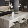 Modern dark kitchen with a waterfall island in Taga Porcelain, including matching splashback and integrated sink area