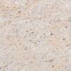 Close up slab photo of Ivory Fantasy Granite showing light beige tones with fine speckling and natural colour variation.