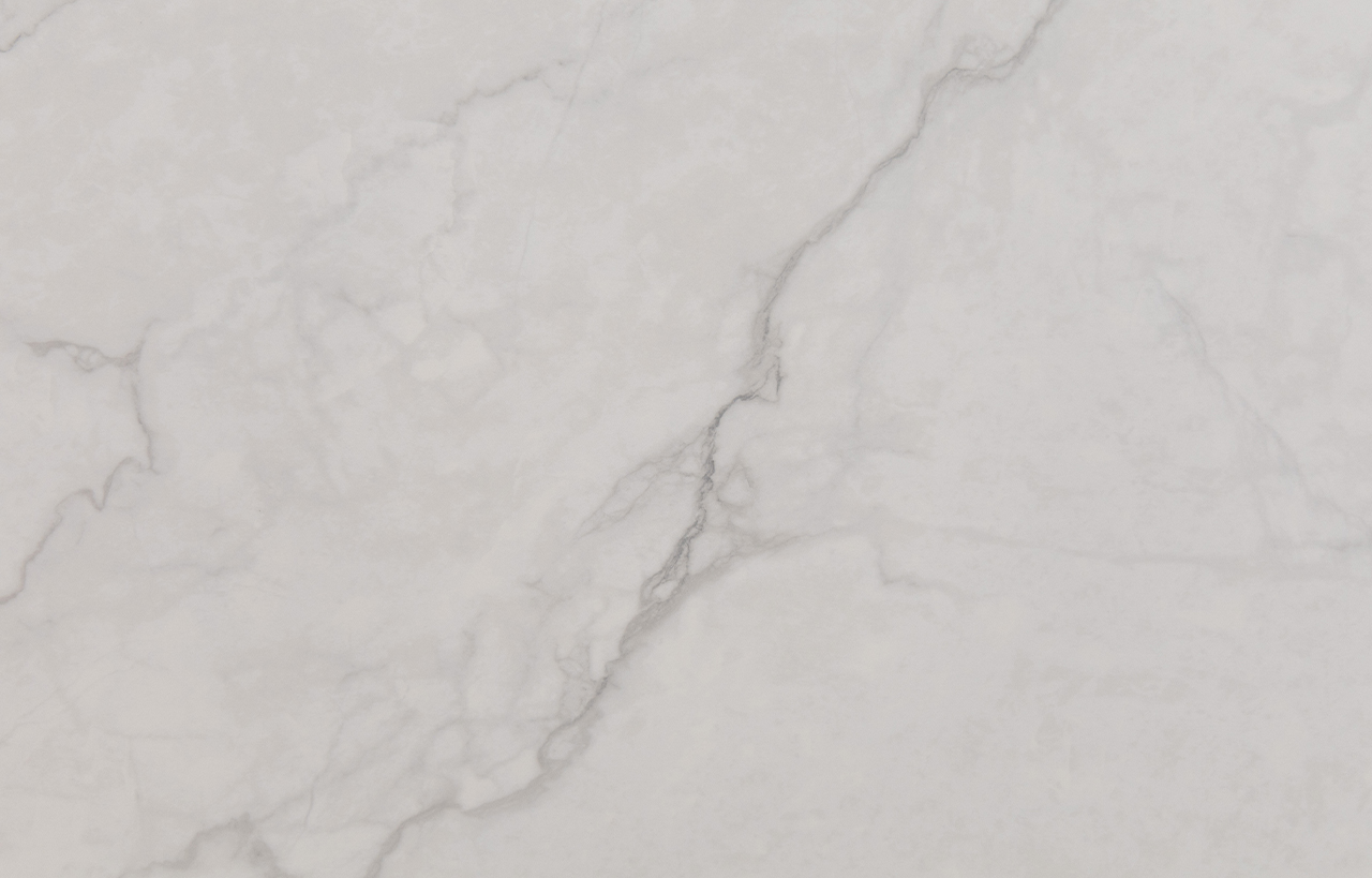 Statuario Venato Porcelain close-up showing a flowing grey vein running diagonally across a white surface.