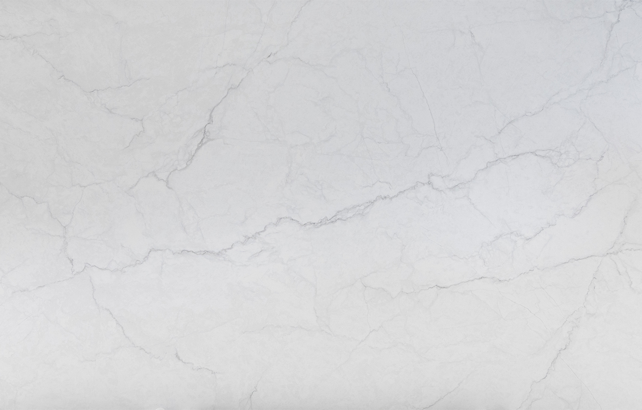 Statuario Venato Porcelain surface detail with very light grey veining and a clean, bright white finish.