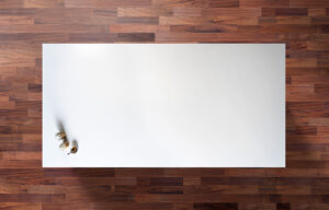 White Thasos Porcelain worktop slab shown from above with a clean bright white surface on a wood background