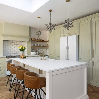 Large kitchen island fitted with Eternal Calacatta Quartz worktops in a bright modern kitchen