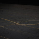 Close-up of Laurent Porcelain worktop surface showing a dark porcelain finish with fine gold veining.