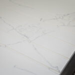 White Macaubus Quartz worktop close-up showing delicate grey veining and a clean white finish