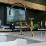 Gold Calacatta worktop with brass tap and undermount sink