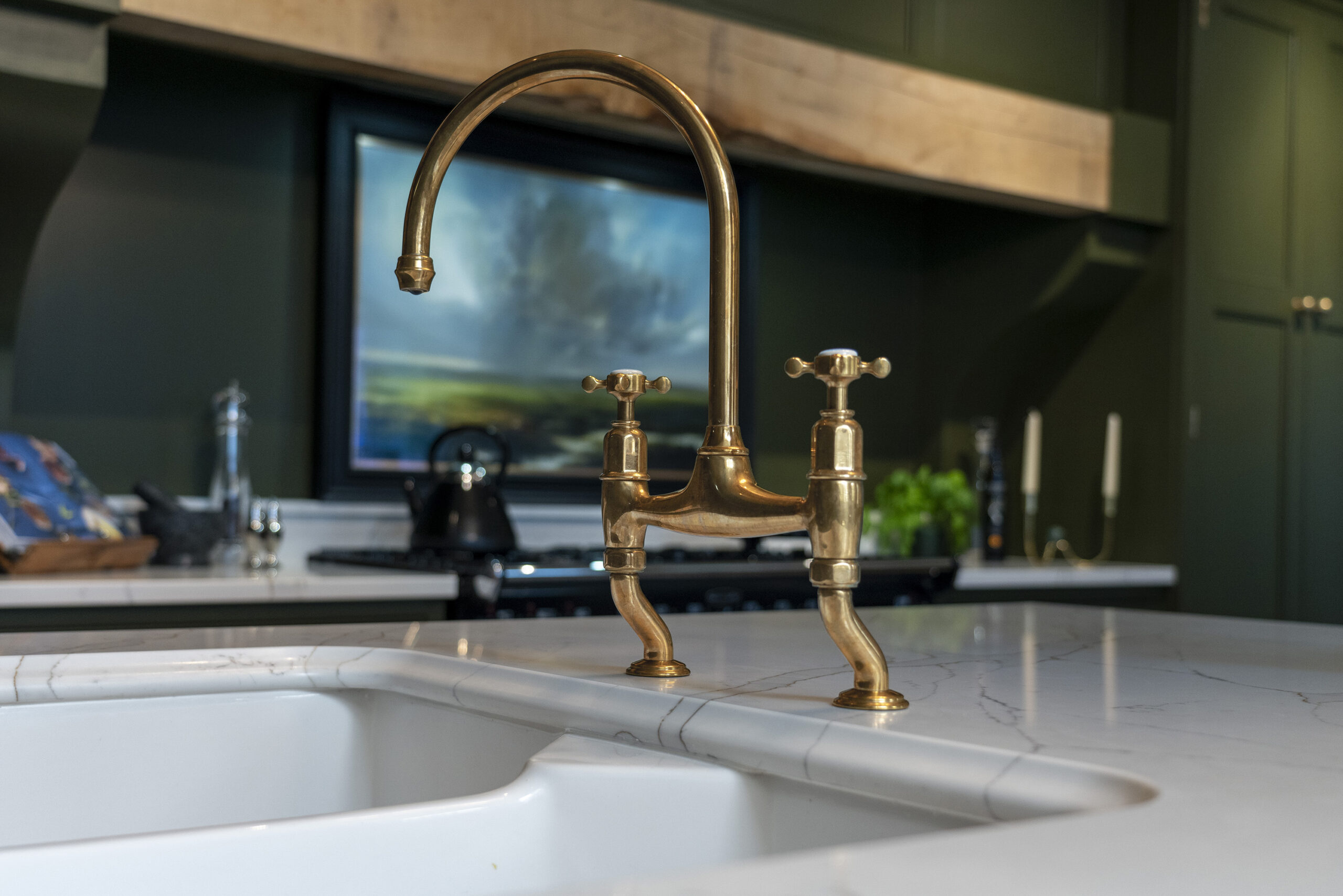 Gold Calacatta worktop with brass tap and undermount sink