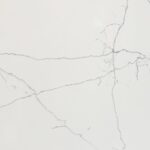Close-up of White Macaubus Quartz showing fine grey veining across a bright white surface