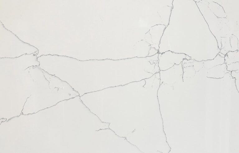Close-up of White Macaubus Quartz showing fine grey veining across a bright white surface