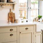 Ice White Quartz worktop along a kitchen run with light cabinetry and warm wood flooring visible
