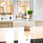 Ice White Quartz worktop surface in a bright kitchen with a smooth white finish and soft background styling