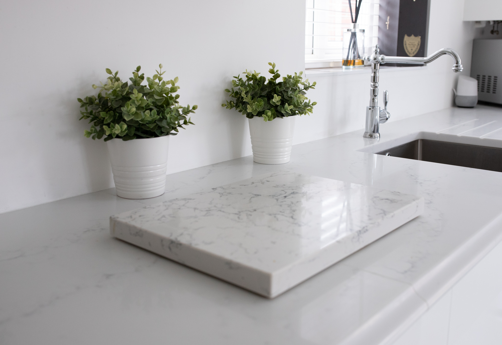 Statuario Bianco Porcelain sample on a countertop showing grey veining and clean finish