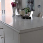 Statuario Bianco Porcelain kitchen island with subtle veining and polished edge detail