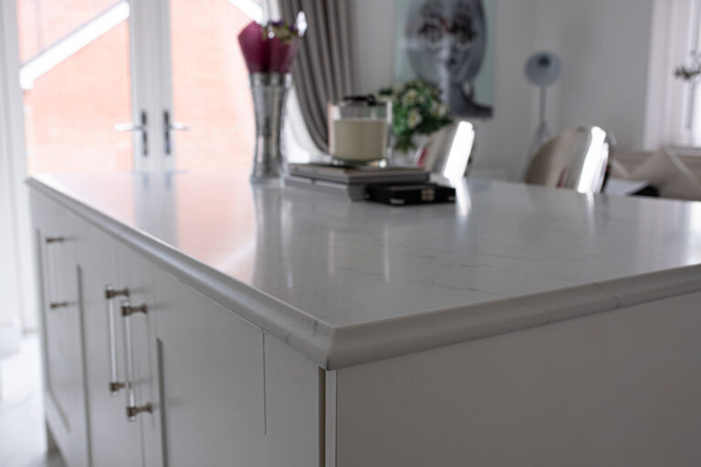 Statuario Bianco Porcelain kitchen island with subtle veining and polished edge detail