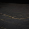 Laurent Porcelain worktop surface close-up showing dark stone-effect finish with fine gold veining