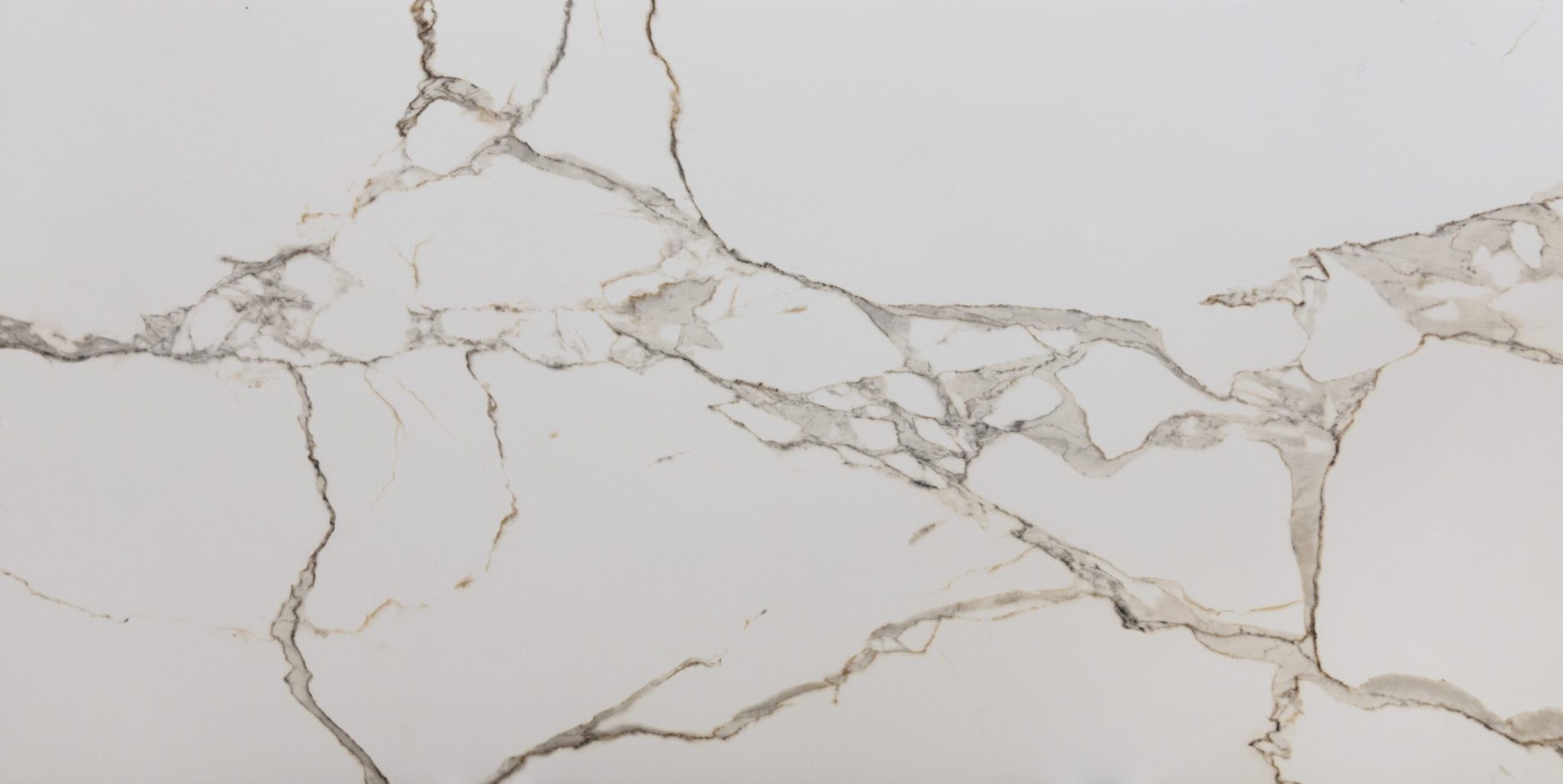 Calacatta Oro Porcelain surface with white background and gold veining