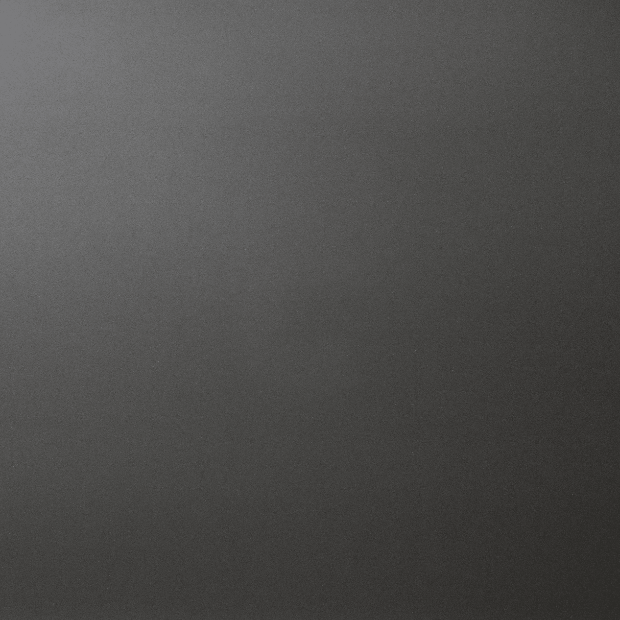 Marengo Quartz slab close-up showing a smooth dark grey surface with a uniform, matte-style finish