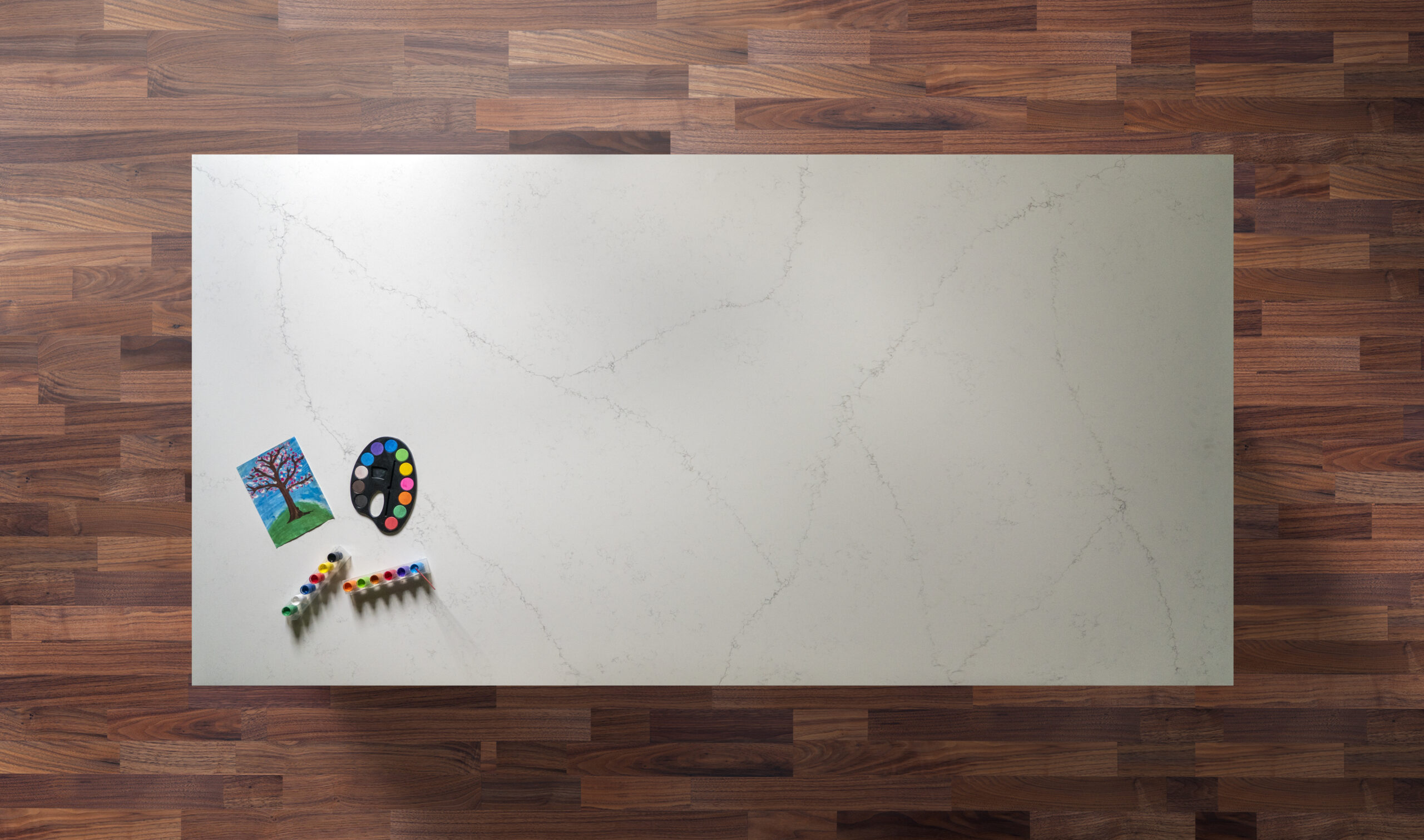 Overhead view of an Olympus White Quartz island worktop with subtle grey veining on a smooth white finish