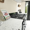 Arabescato Quartz worktop beside a range cooker, showing grey veining and a smooth white finish