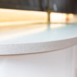 Ice White Quartz worktop edge close-up showing a rounded front profile and smooth white finish
