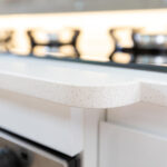 Ice White Quartz worktop edge detail showing a rounded front profile in a narrow boat galley