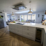Aspen Shimmer Quartz worktops in a modern open plan kitchen with island seating
