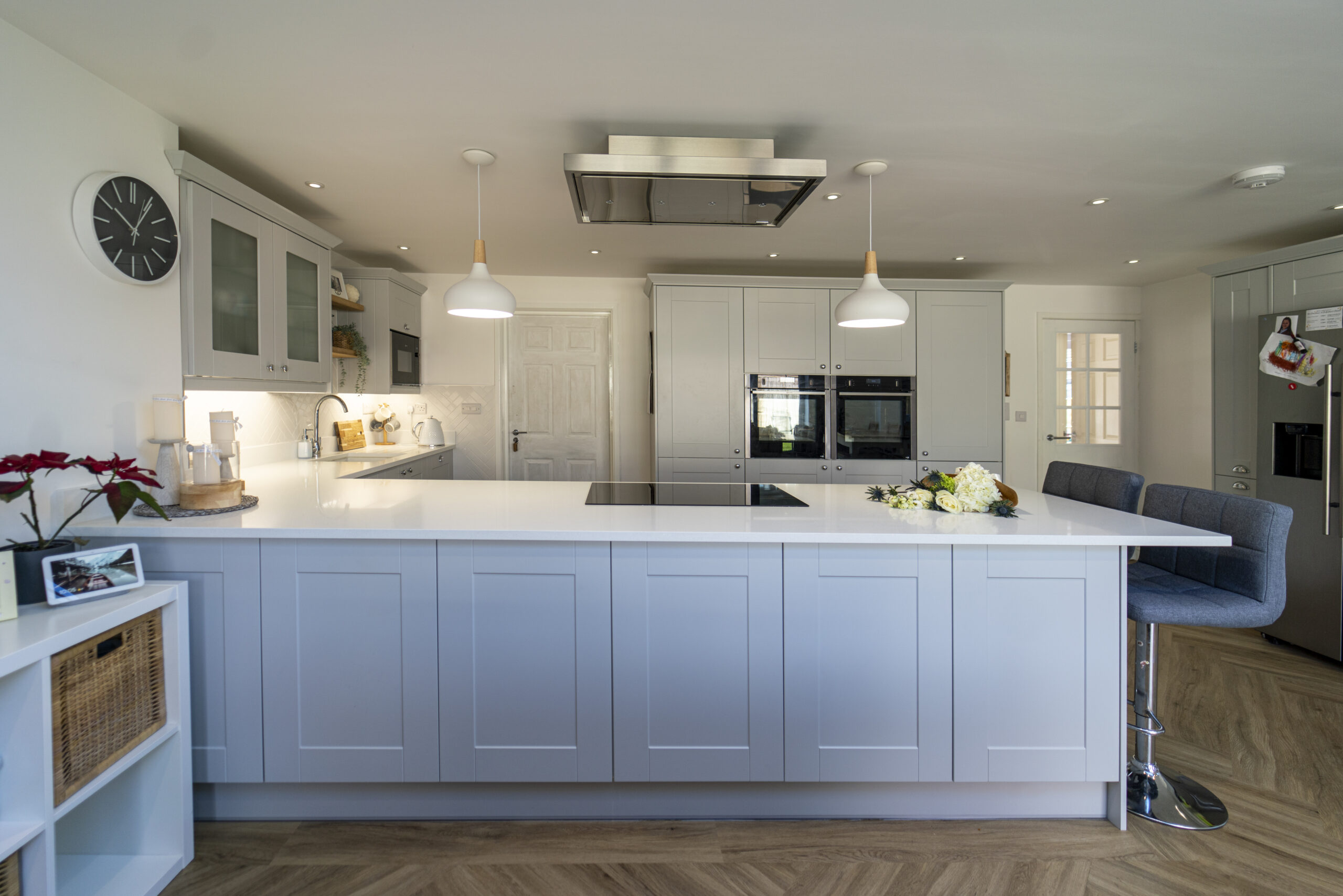 Aspen Shimmer Quartz kitchen island in a bright white modern kitchen