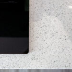Close up of White Starlight Quartz surface showing fine sparkle and aggregate detail
