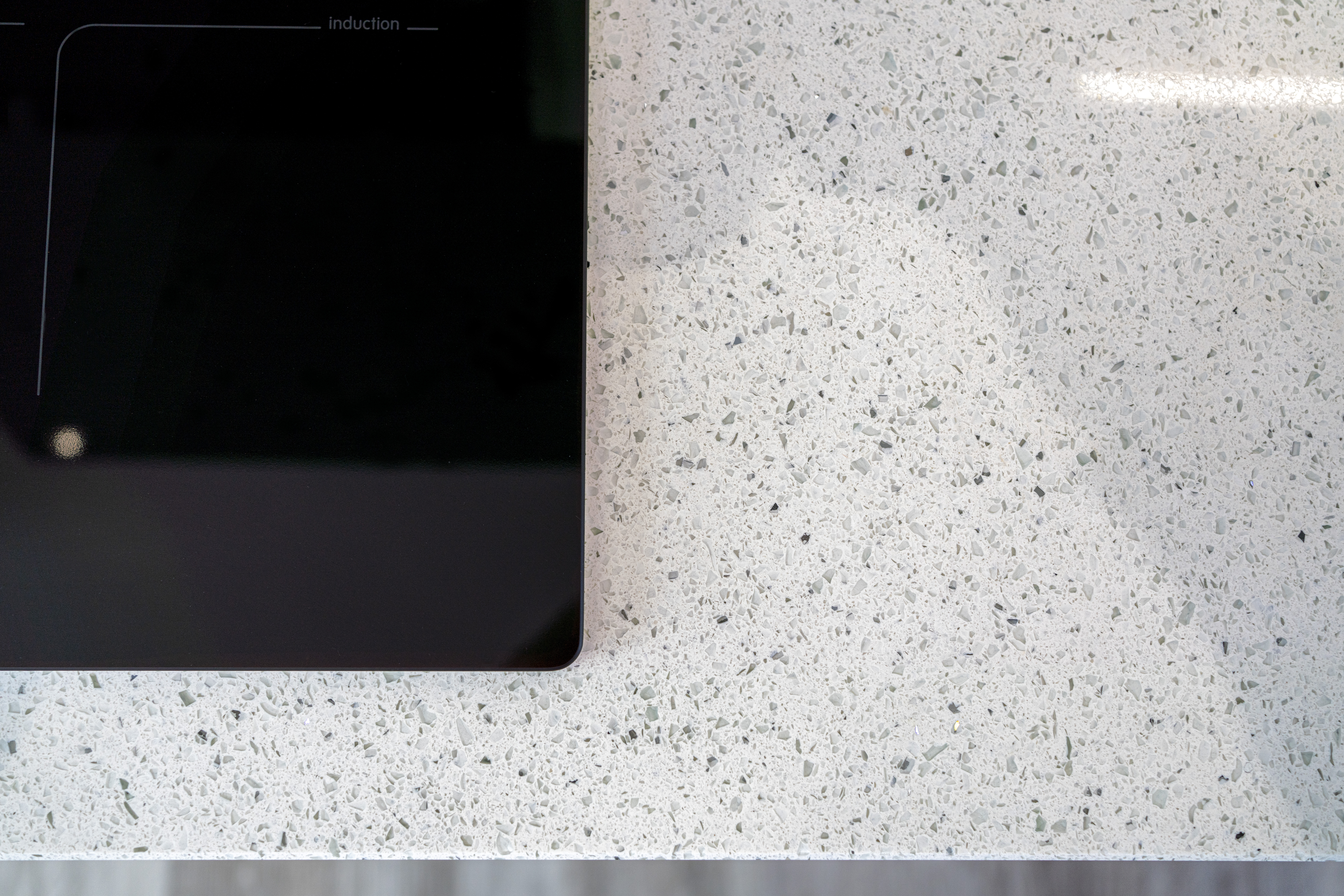 Close up of White Starlight Quartz surface showing fine sparkle and aggregate detail