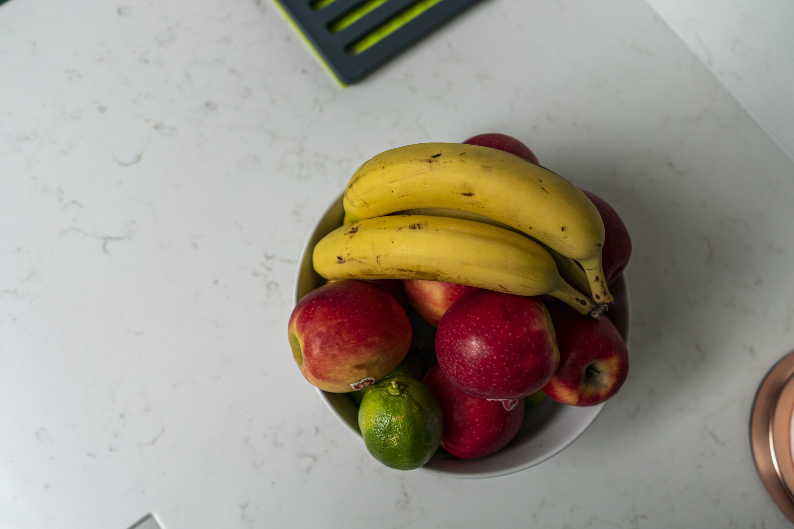 Fruit bowl placed on Carrara Quartz worktop in a modern kitchen