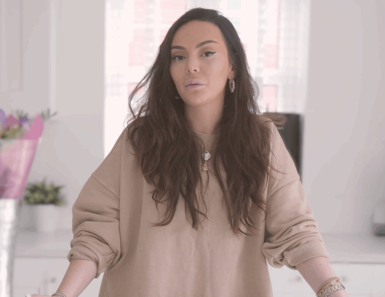 Tania giving a testimonial in her kitchen featuring Statuario Bianco Porcelain worktops installed by Mayfair Worktops