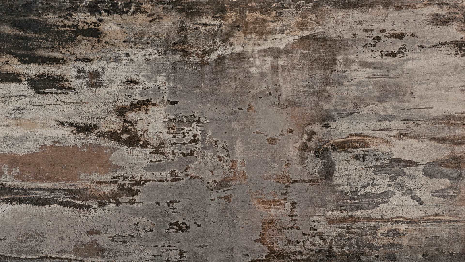 Trilium Porcelain surface close-up showing layered grey tones with warm rust-style markings and mottled movement