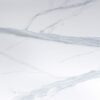 Volakas White Porcelain slab close up showing soft grey veining across a bright white background