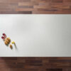 White Starlight Quartz worktop slab shown on a wooden surface with fruit styling