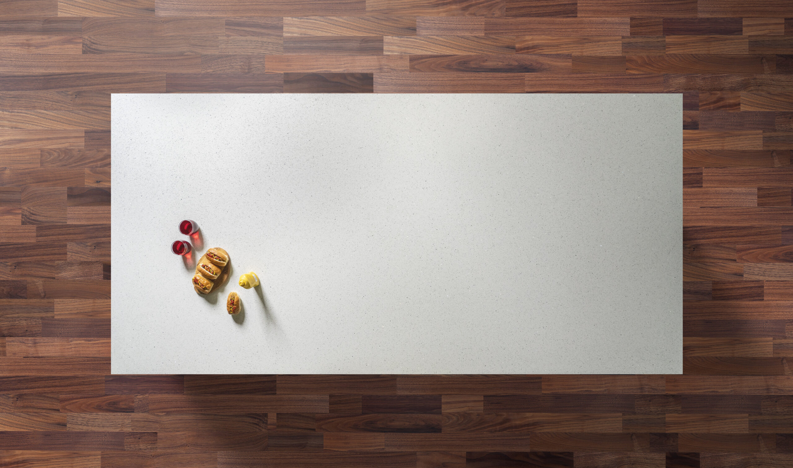 White Starlight Quartz worktop slab shown on a wooden surface with fruit styling
